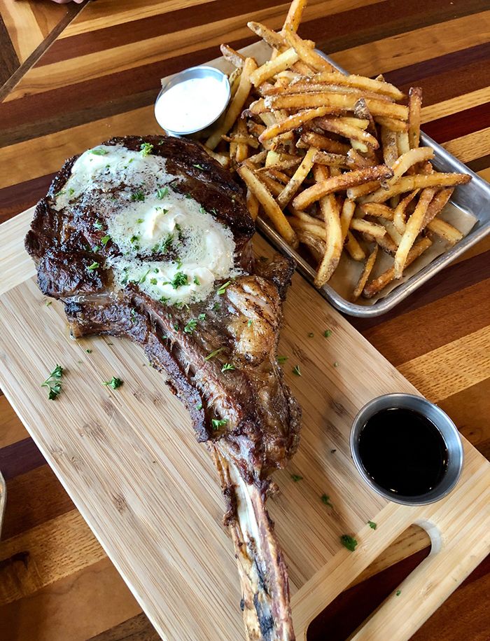 tomahawk ribeye cooked at new york butcher shoppe