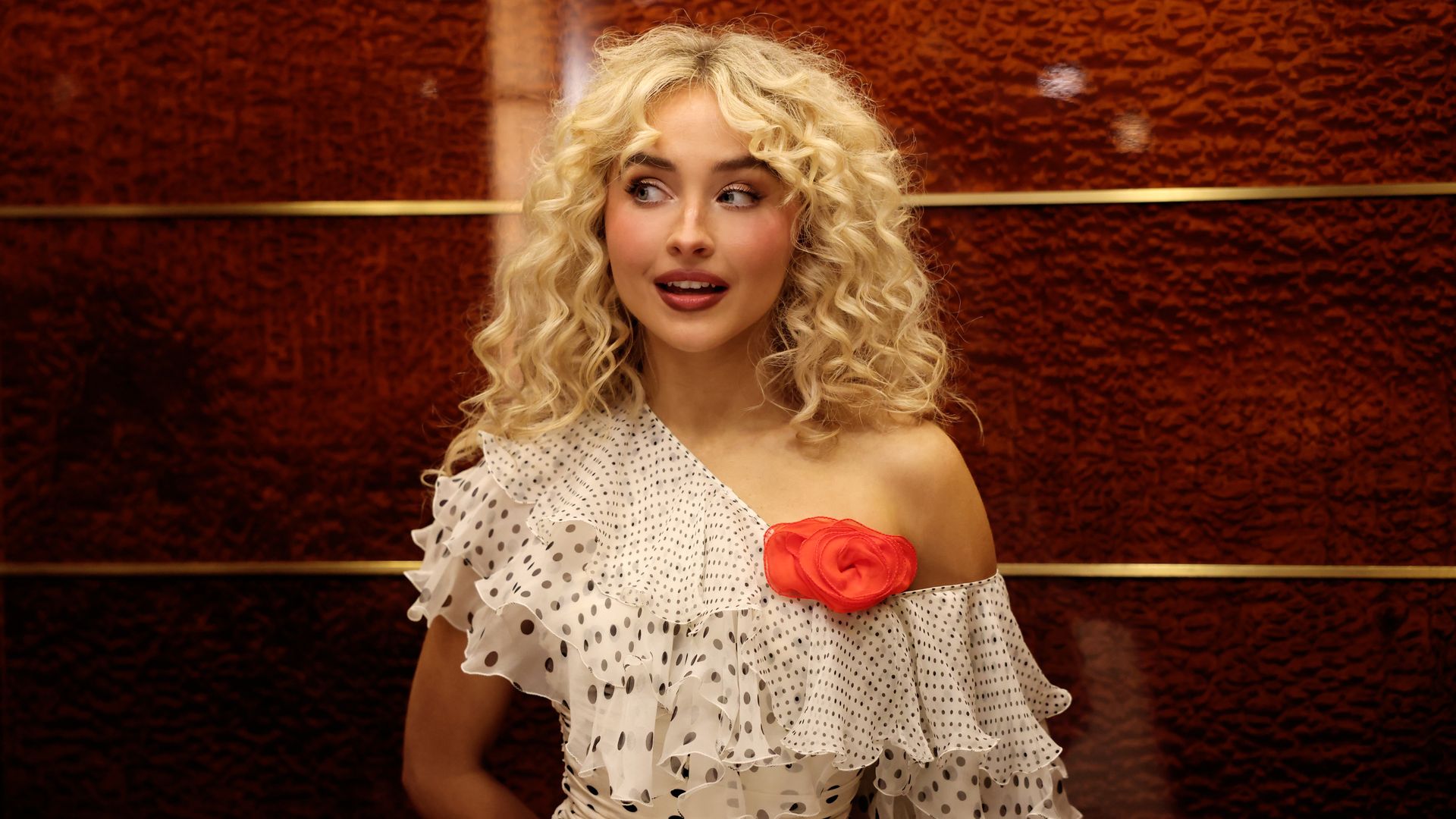 Sabrina Carpenter stands on the “Saturday Night Live” stage during promos for her hosting and musical guest debut in October 2025.