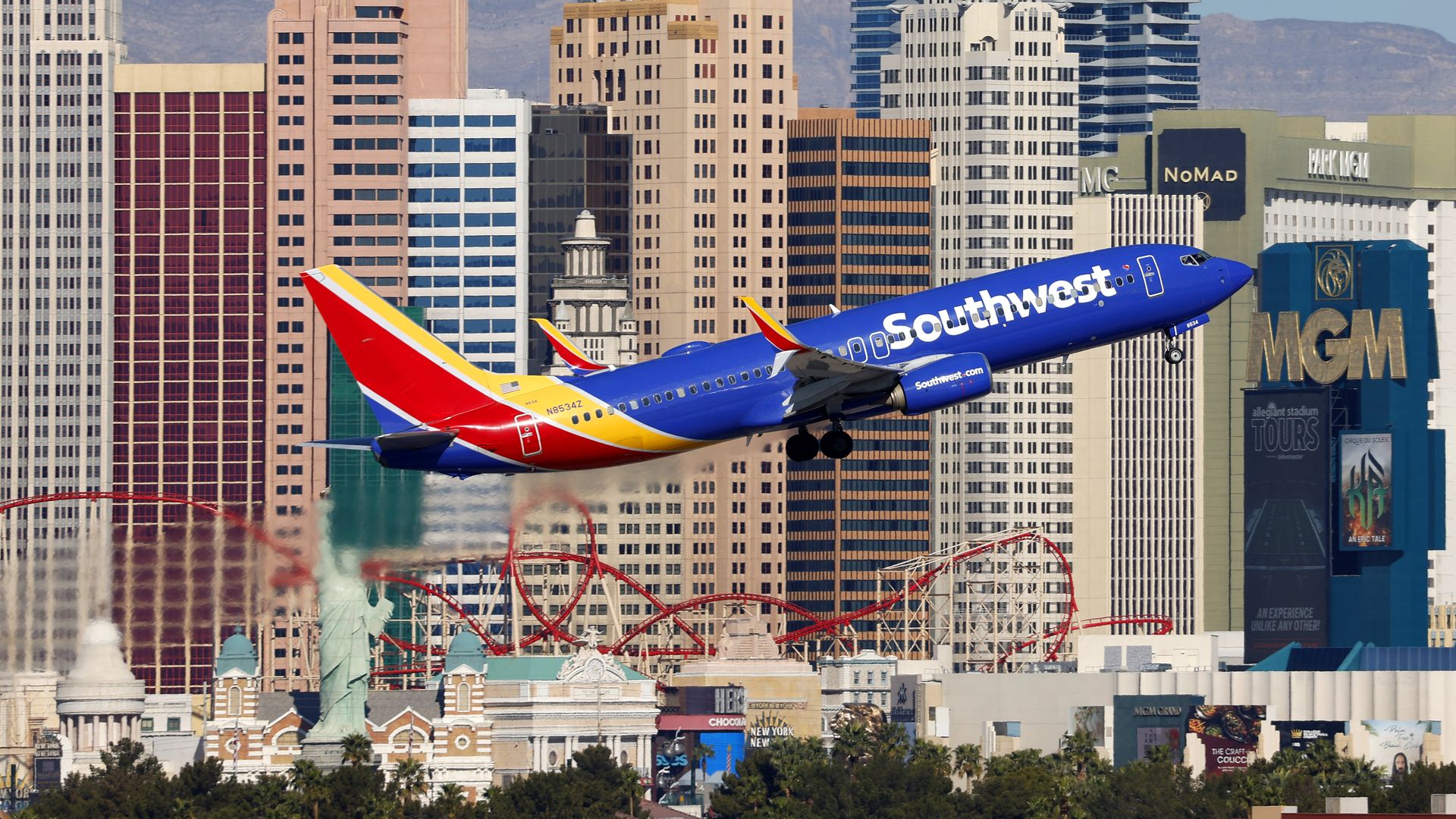 A Southwest Airlines plane takes off with the Las Vegas Strip skyline behind it