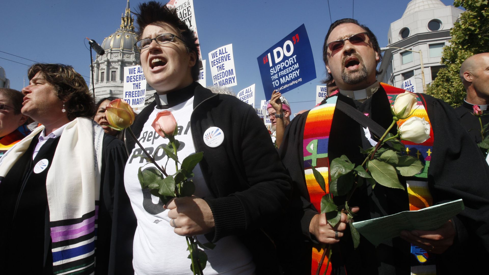 Megan Rohrer (left), from the Welcome Ministry in San Francisco, and Reverend Will McGarvey, from the Community Presbyterian Church in Pittsburg, stand in front of the steps of the Supreme Court.