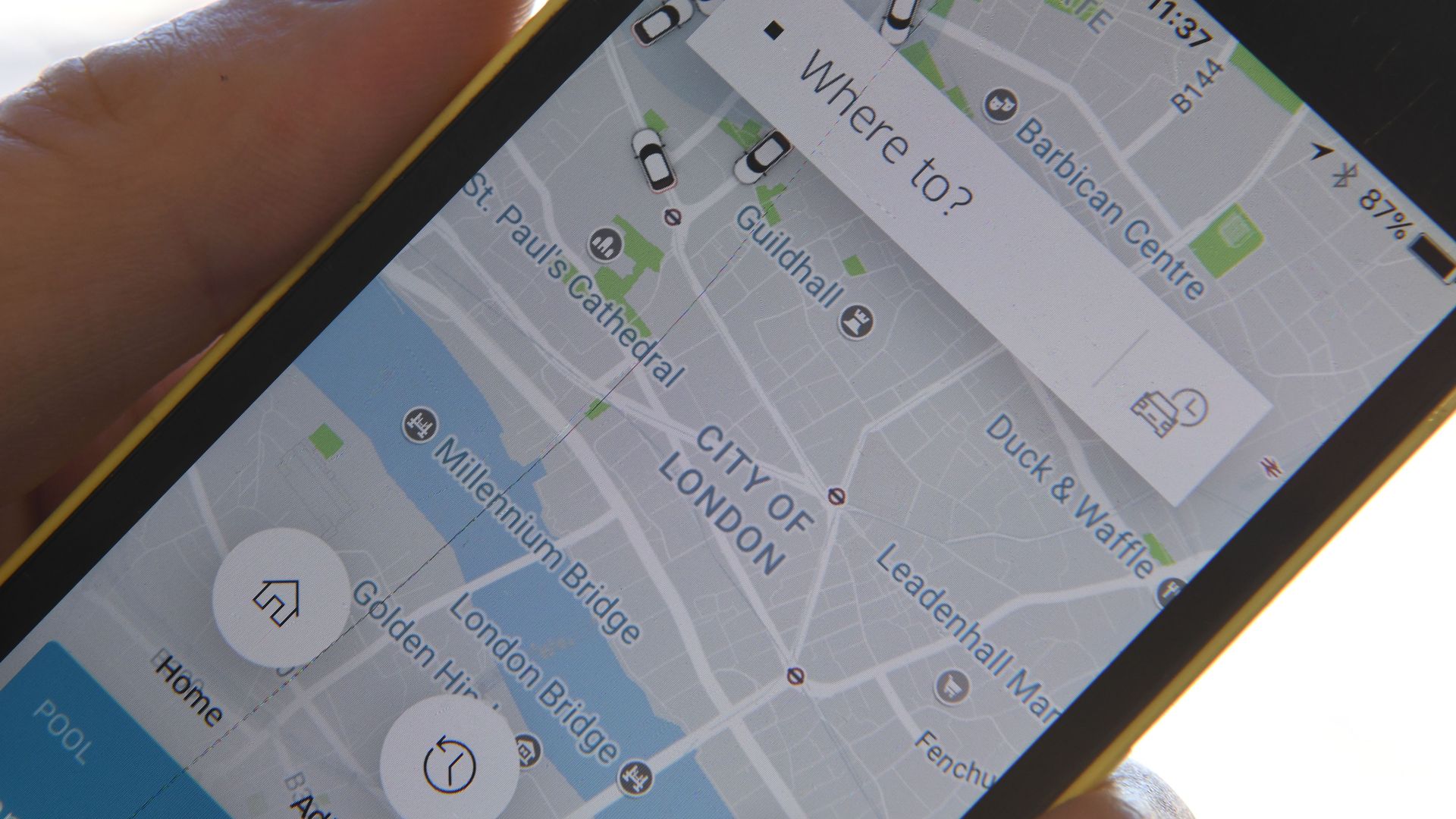 A phone showing the Uber app in London