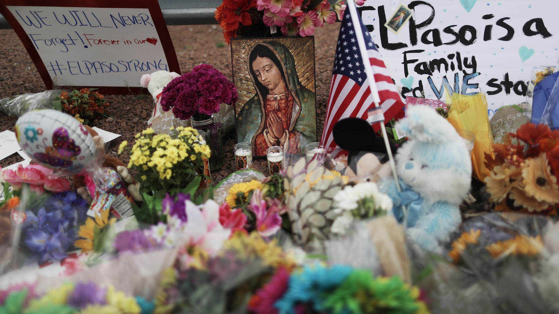 Flowers and mementos are seen at a makeshift memorial outside Walmart, near the scene of a mass shooting which left at least 20 people dead, on August 4, 2019 in El Paso