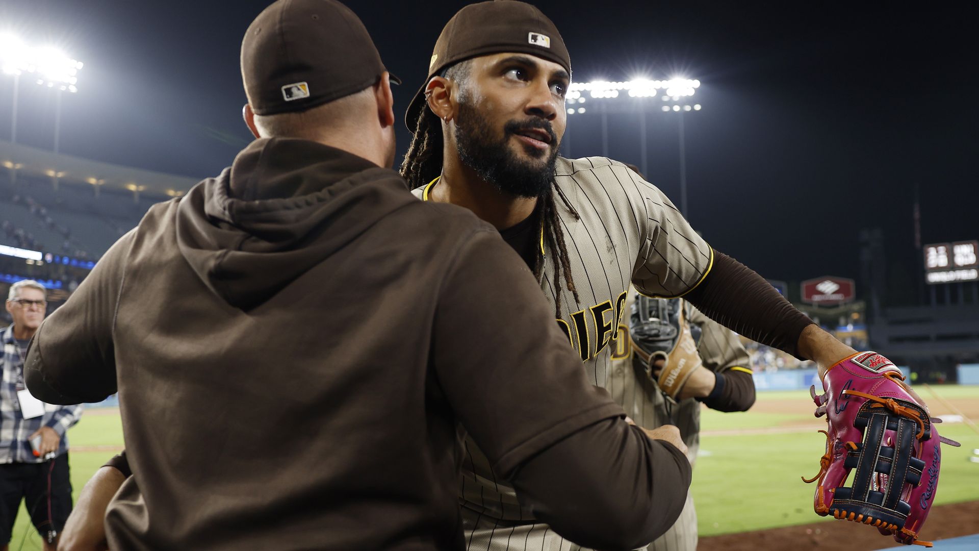 Los Angeles, CA - September 23: Fernando Tatis Jr. #23 of the San Diego Padres hugs manager Craig Stammen after a win against the Los Angeles Dodgers at Dodger Stadium on September 23, 2026 in Los Angeles, CA. (Photo by K.C. Alfred / The San Diego Union-Tribune via Getty Images)