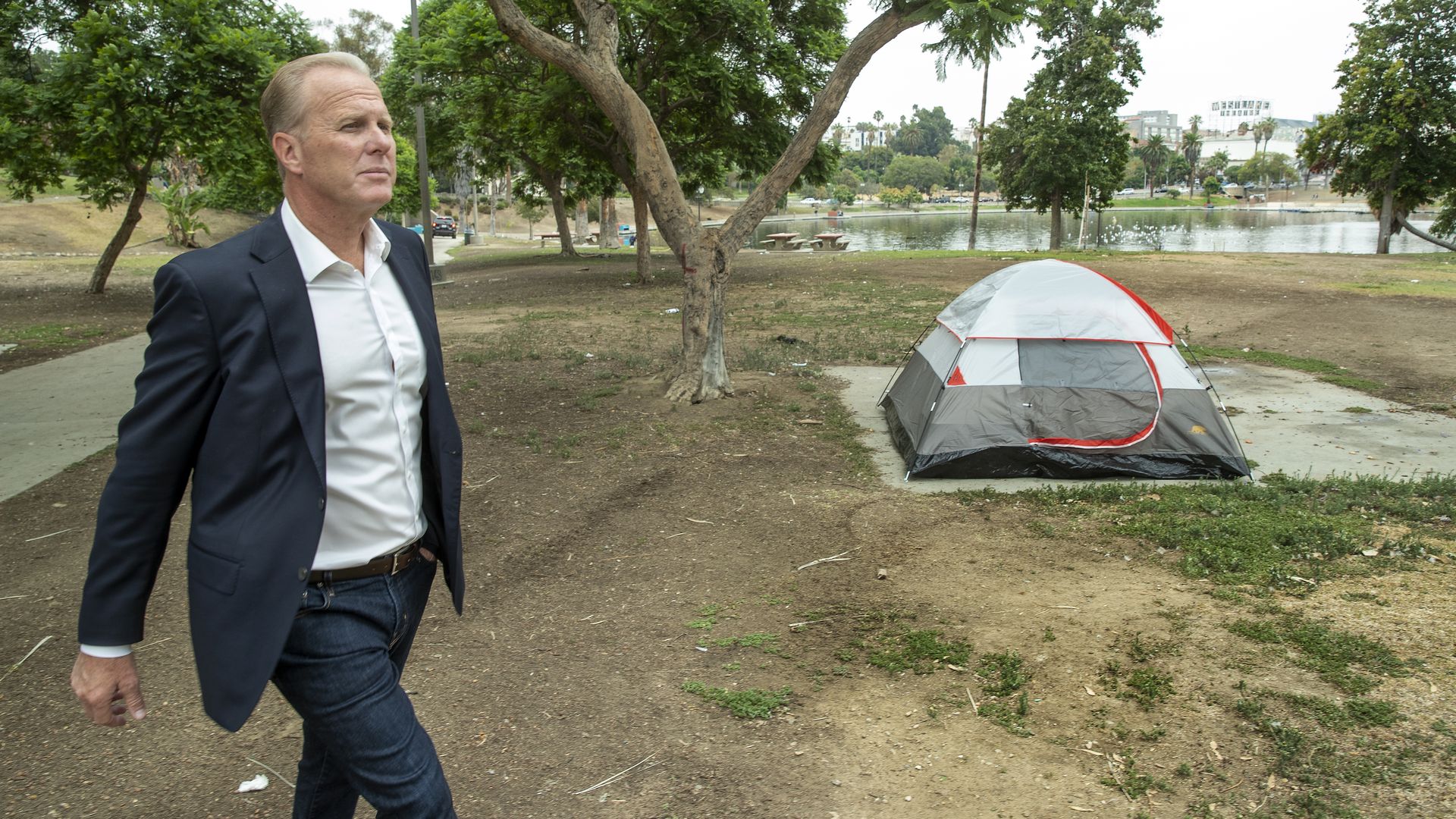 Kevin Faulconer walks near a tent