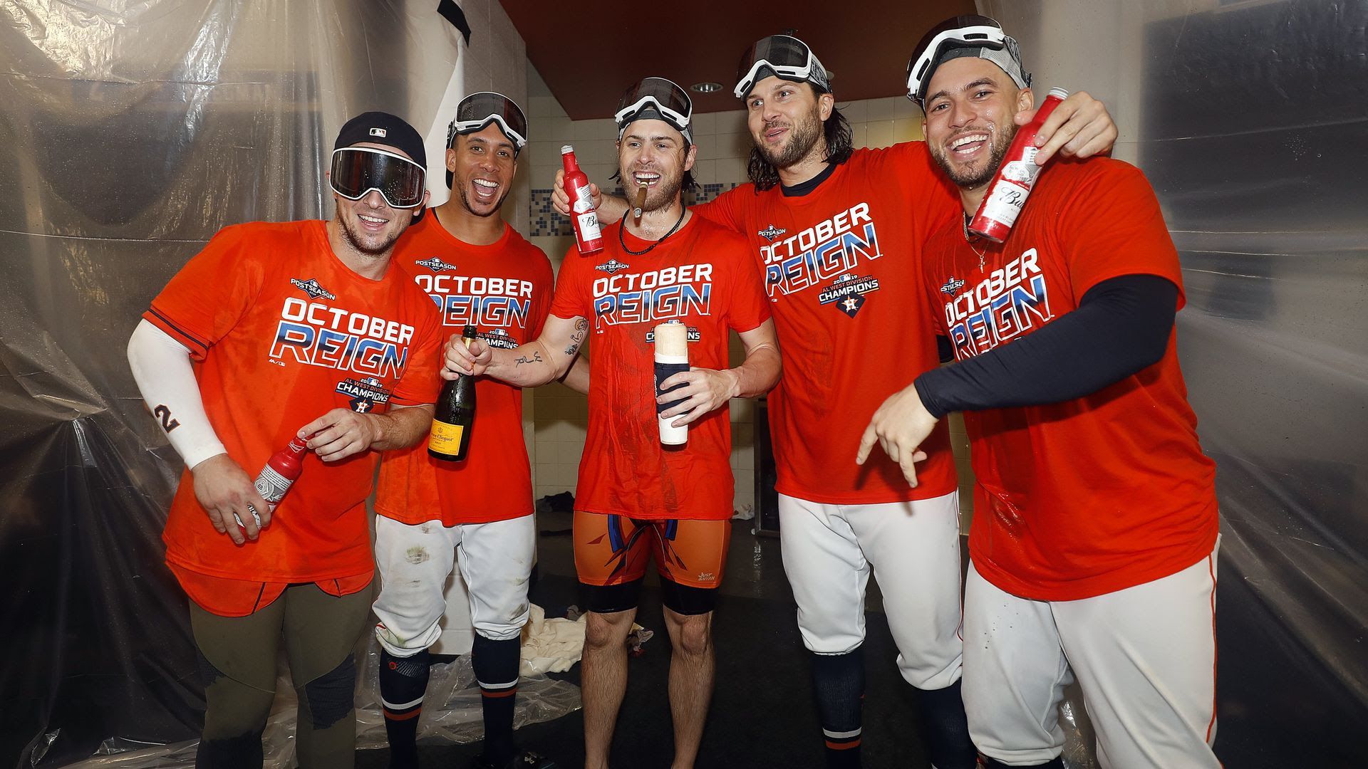 Baseball players popping bottles