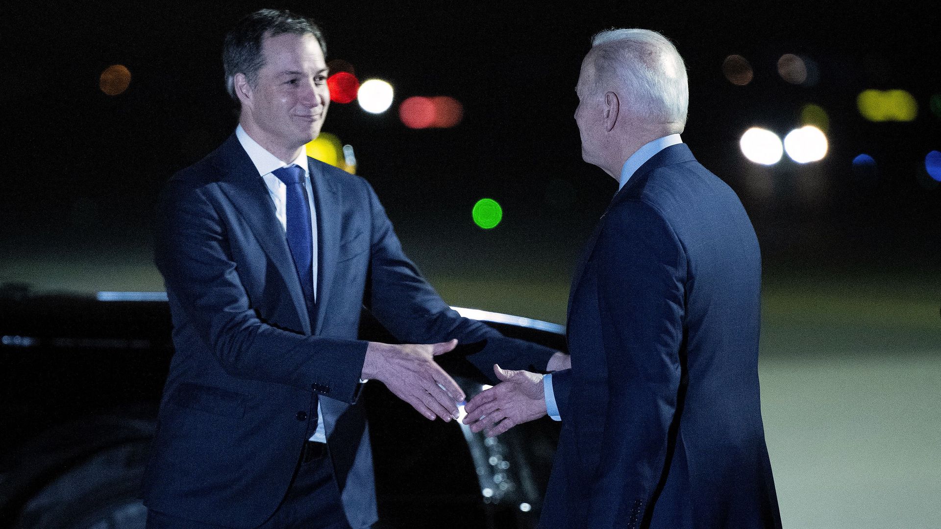 President Biden is seen shaking hands with Belgium's prime minister upon arriving for a NATO meeting.