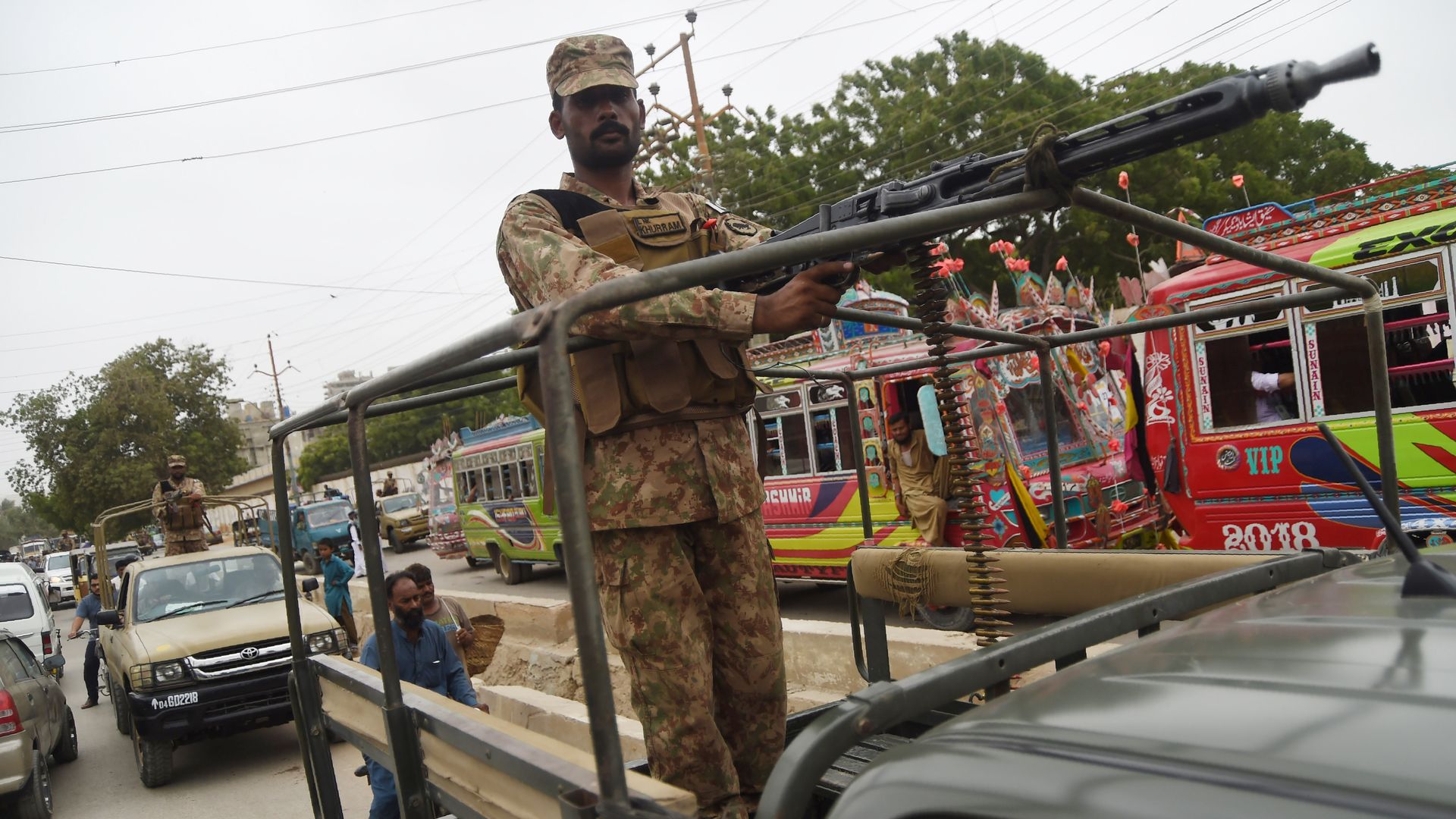 Pakistani soldiers patrol a street in an armored truck in the port city of Karachi on July 24, 2018. 