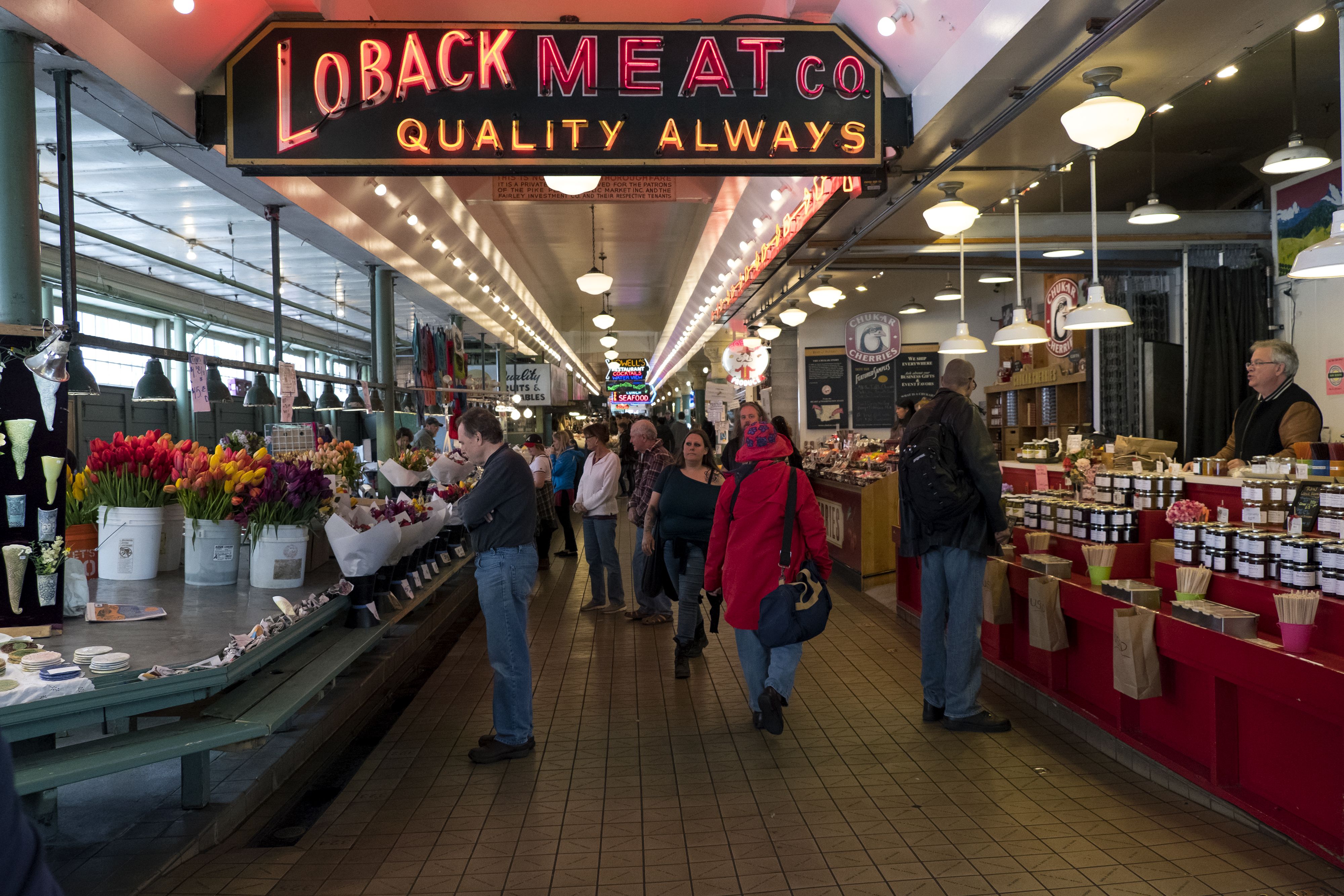 Shoppers browse inside Pike Place Market