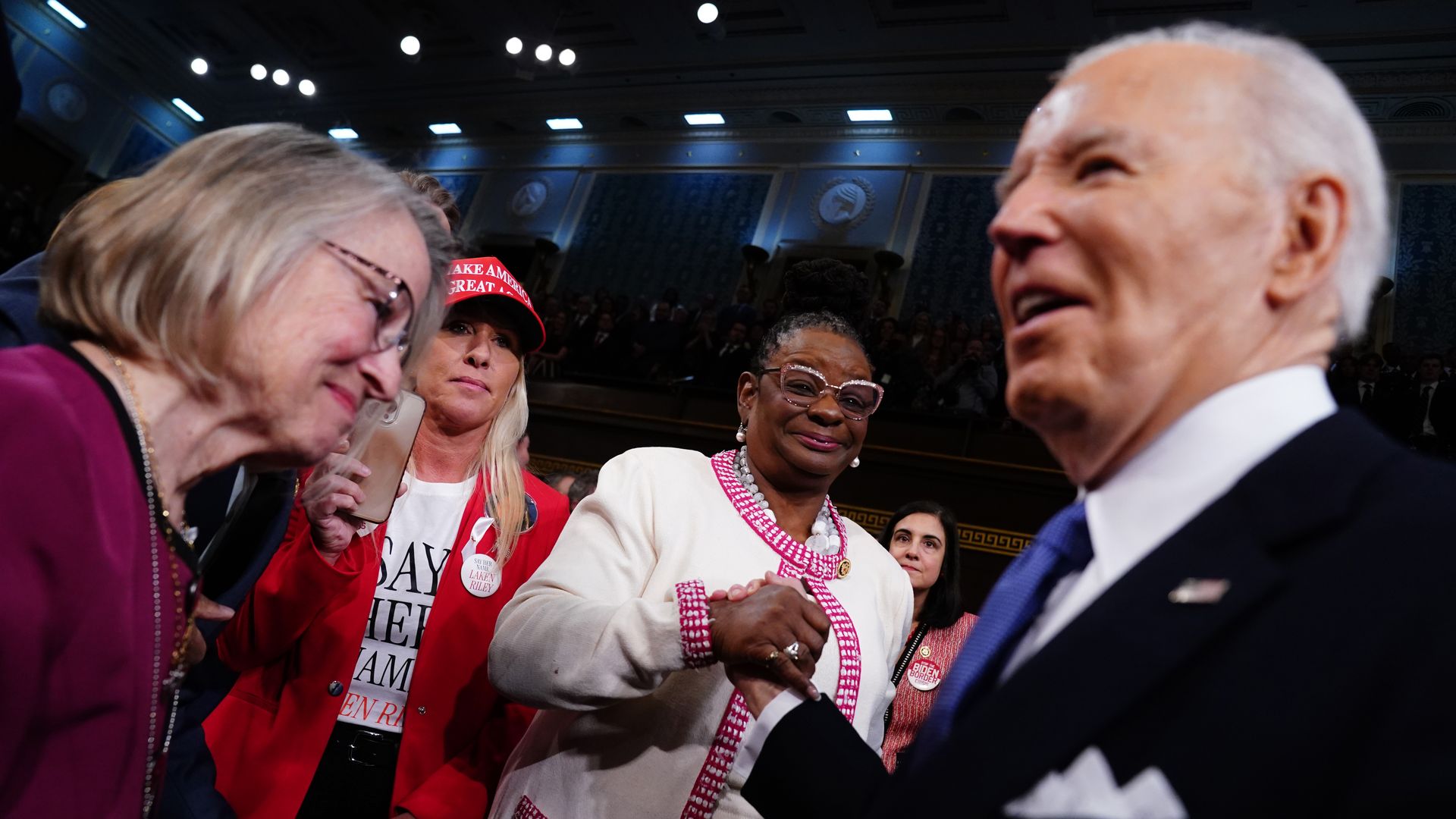  U.S. Rep. Marjorie Taylor Greene (R-GA) looks on as President Joe Biden arrives in the House chamber to deliver the annual State of the Union address