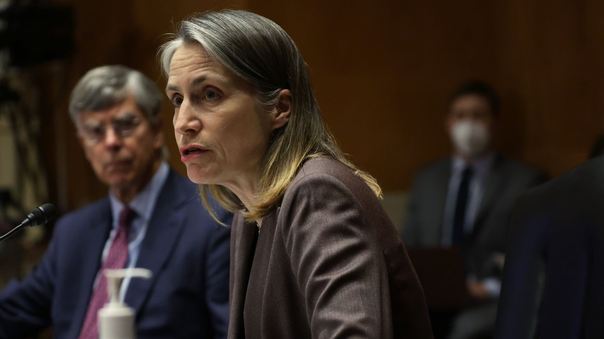 William Taylor and Fiona Hill, two former players in President Trump's second impeachment, are seen testifying on Capitol Hill.