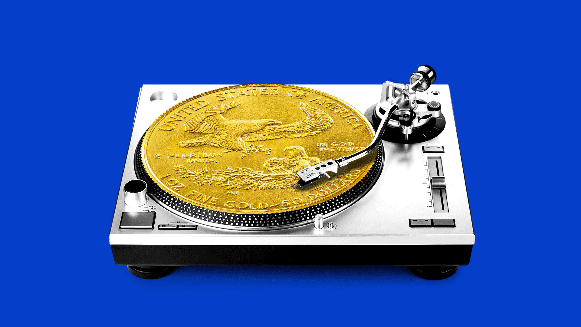 A turntable with a record shaped like a gold coin spinning on top of it.