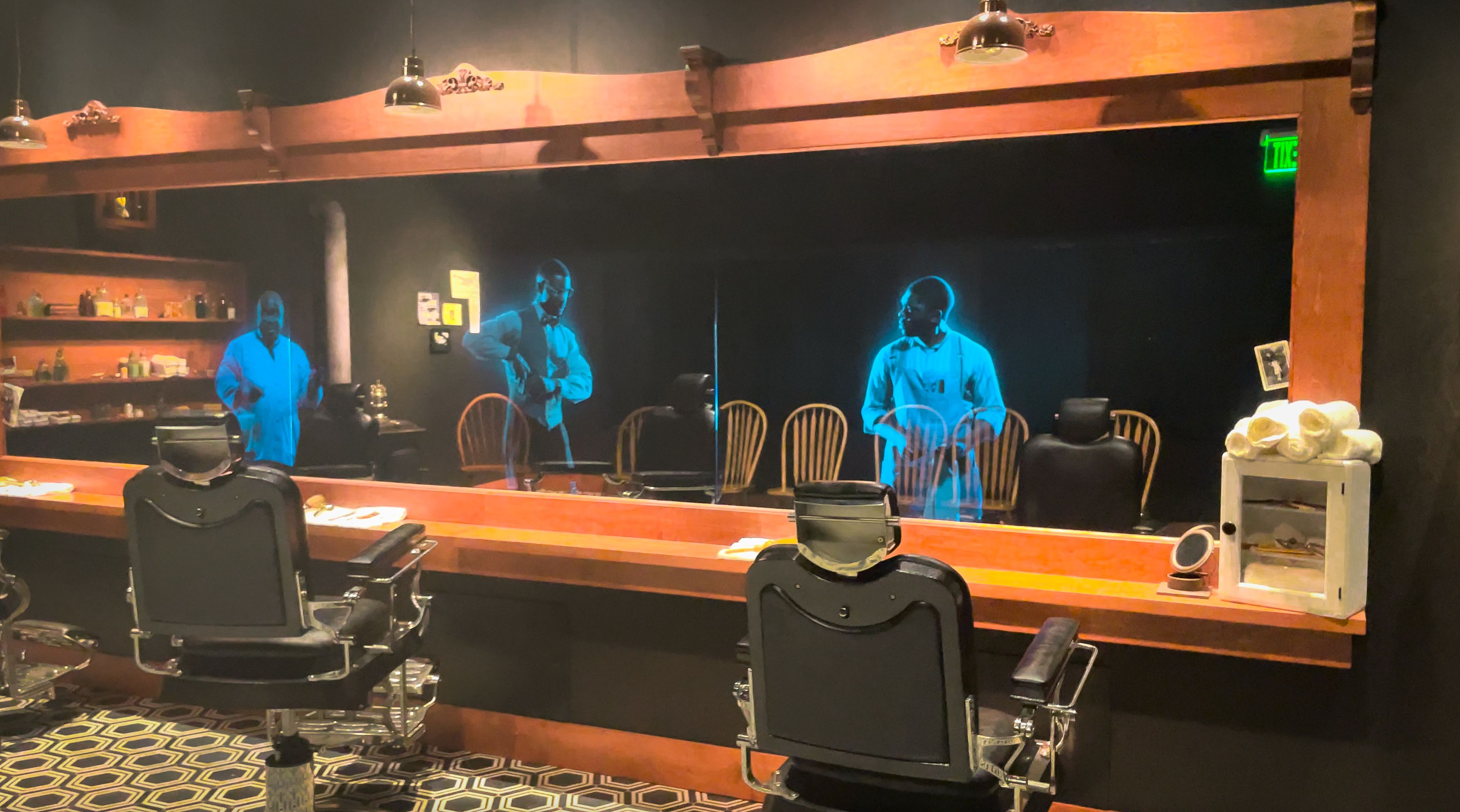 A period barbershop comes to life with holographic barbers at the Greenwood Rising History Center, a museum dedicated to telling the story of the 1921 Tulsa Race Massacre.